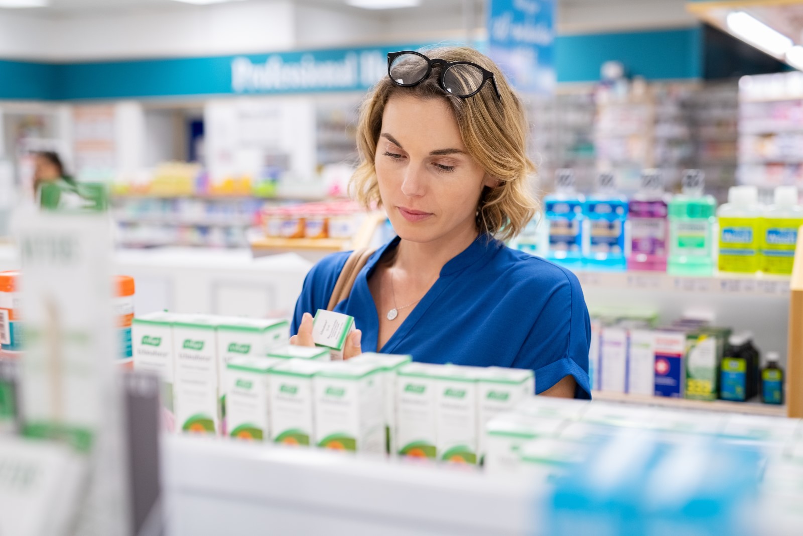 woman choosing pharmacy product