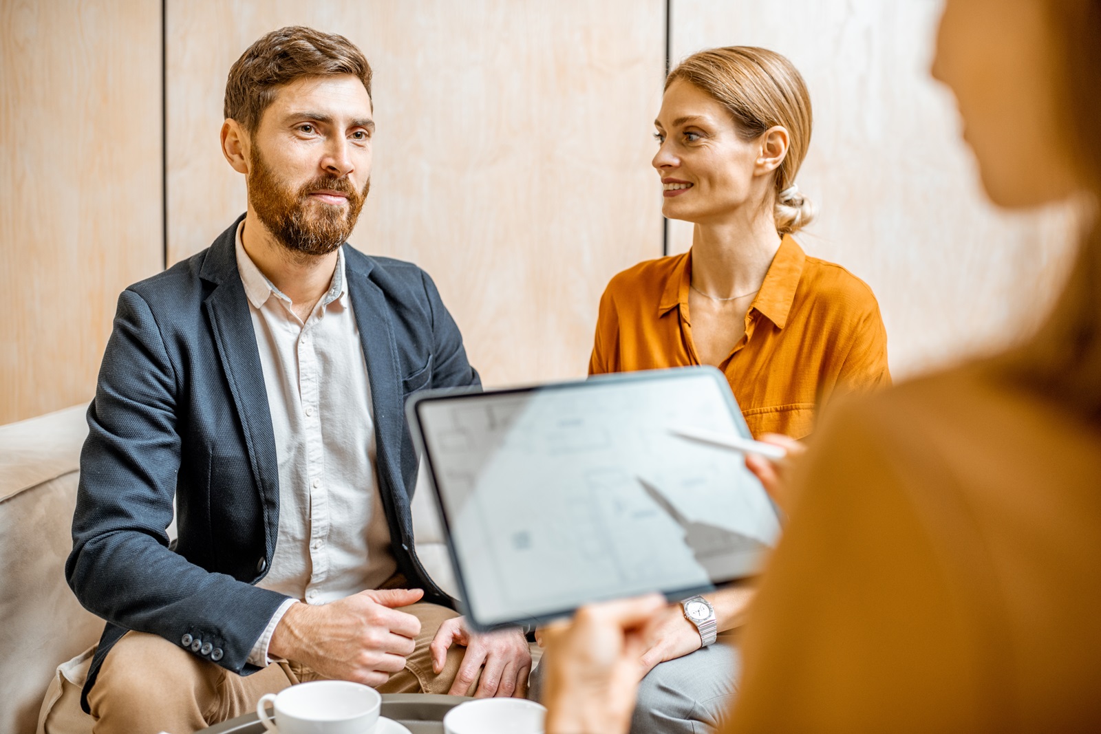 A couple discusses estate planning with an attorney.